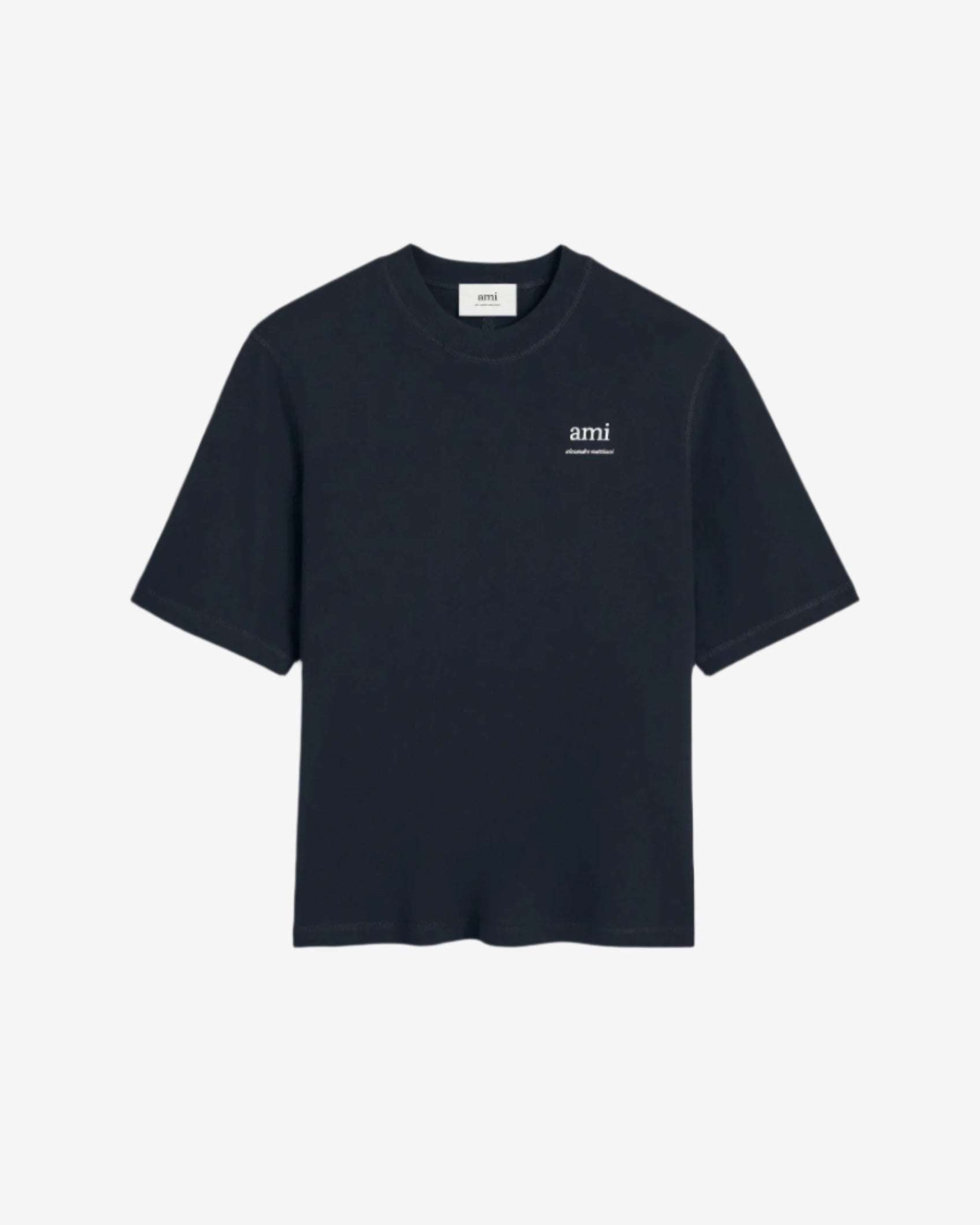 Navy blue t-shirt with 'ami' logo on a beige background ami paris