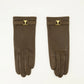 Pair of brown gloves with gold logo on a white background AMI PARIS