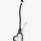 Heart-shaped pendant with leopard print on a black cord against a white background