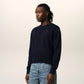Navy blue sweater with a red heart and letter 'A' logo on a white background