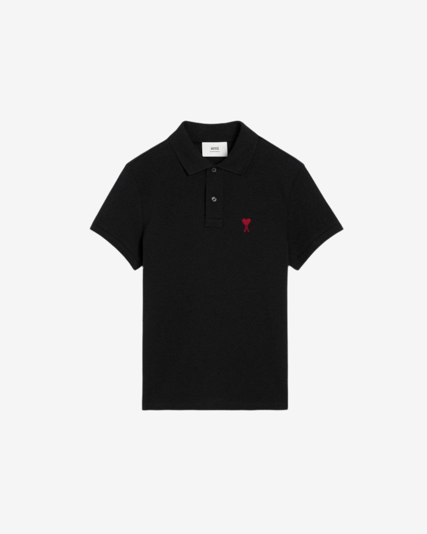 Black polo shirt with a small red logo on a beige background