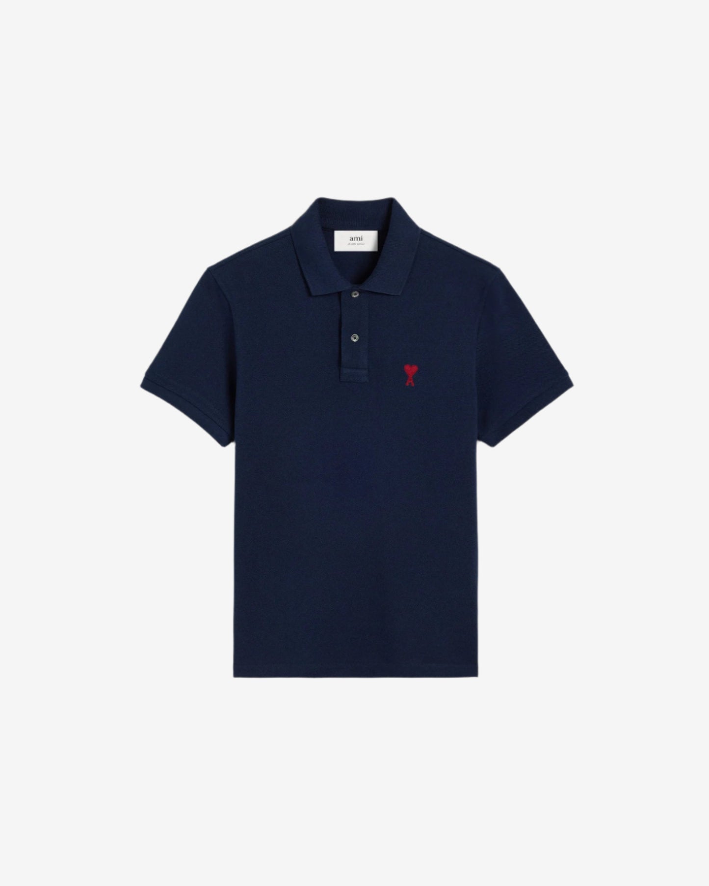 Navy blue polo shirt with a red heart logo on a beige background