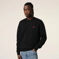 Black sweatshirt with a red logo on a beige background