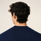Navy blue sweatshirt with a red logo on a beige background ami paris