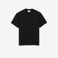 Black t-shirt with a small red logo on a beige background ami paris