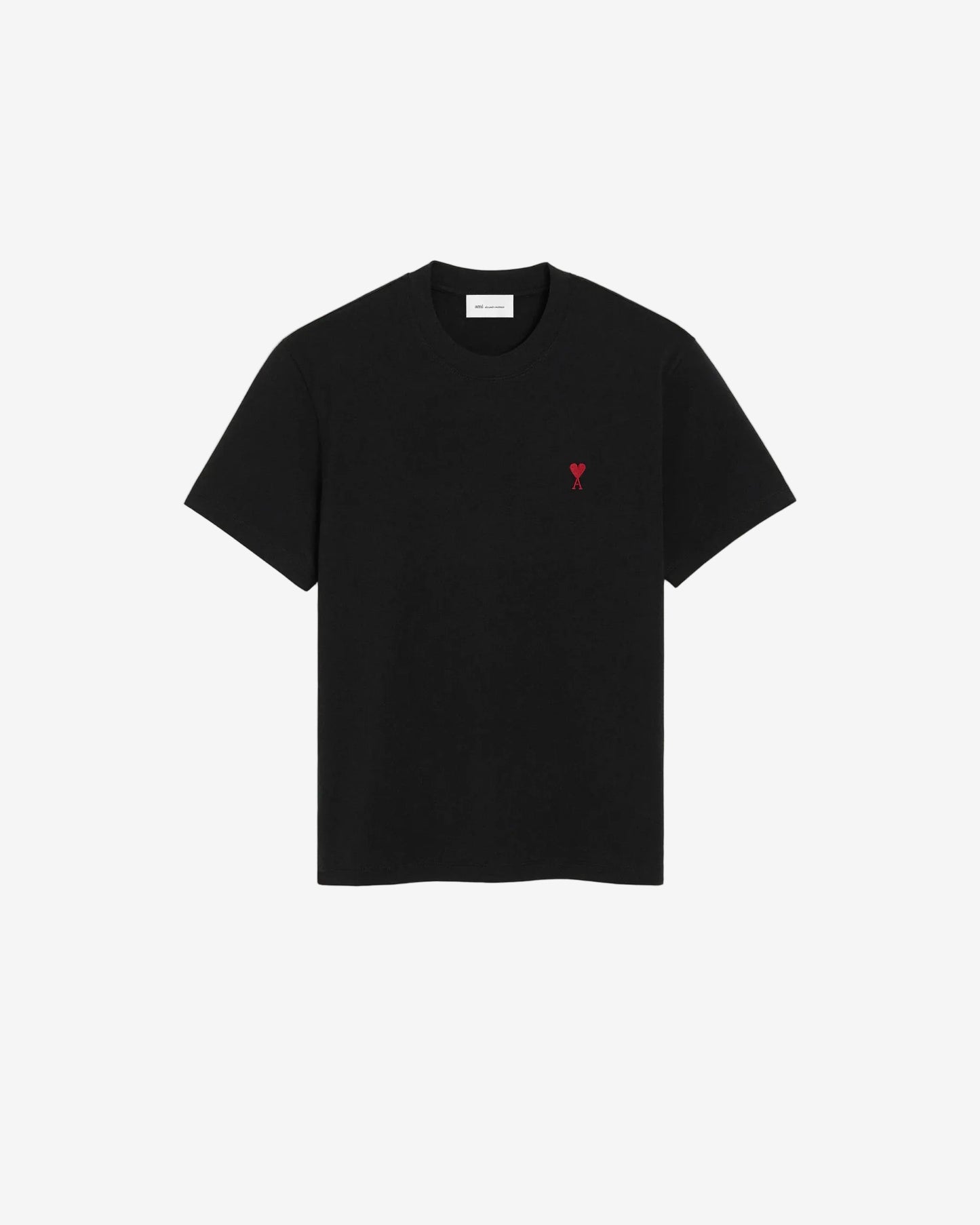 Black t-shirt with a small red logo on a beige background ami paris