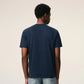 Navy blue t-shirt with a small red logo on a beige background ami paris