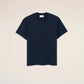 Navy blue t-shirt with a small red logo on a beige background ami paris