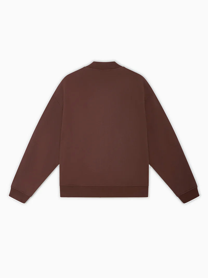 Brown jacket with a visible brand label on a white background