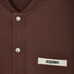 Brown jacket with a visible brand label on a white background
