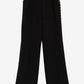 Black pants with studded details on a white background