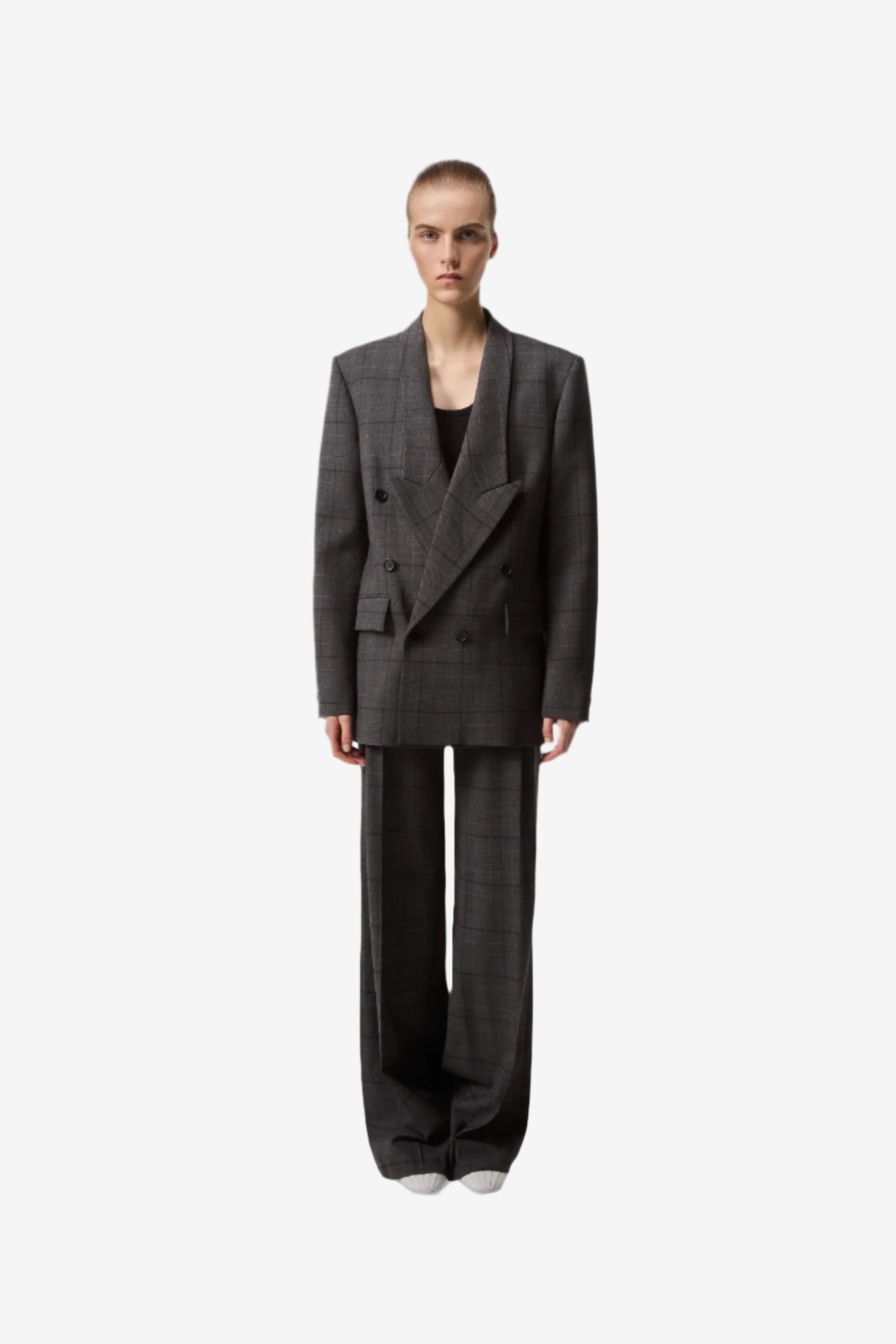 Person wearing a gray suit on a white background