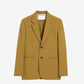 Tan blazer on a light beige background