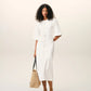 Long dress in light cotton gabardine with short sleeves and bold contrasted topstitches