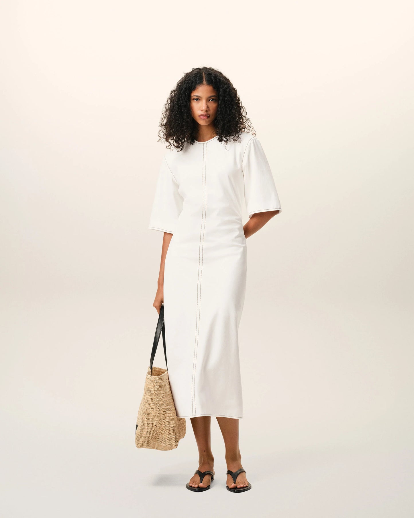 Long dress in light cotton gabardine with short sleeves and bold contrasted topstitches