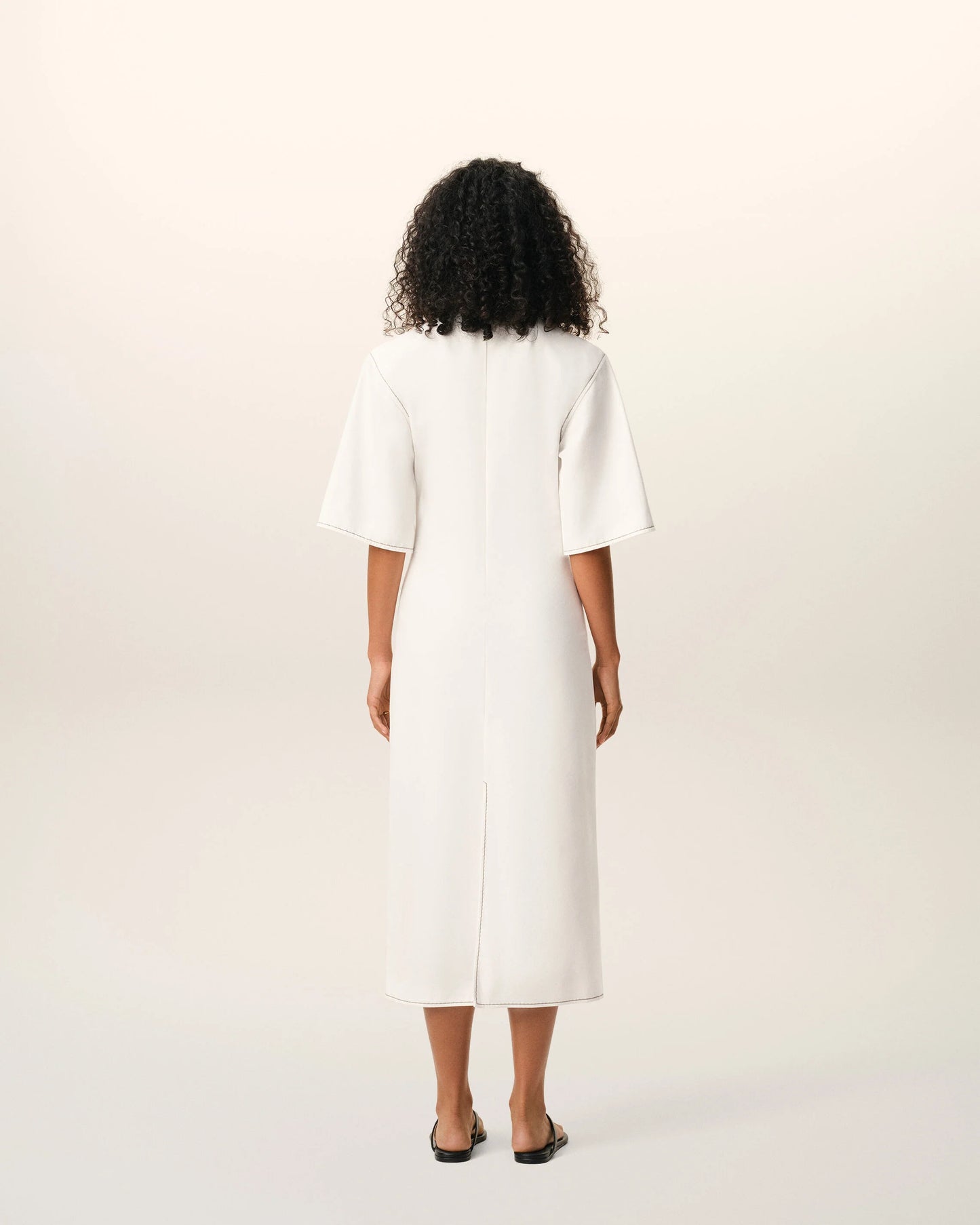 Long dress in light cotton gabardine with short sleeves and bold contrasted topstitches