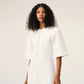 Long dress in light cotton gabardine with short sleeves and bold contrasted topstitches