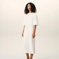 Long dress in light cotton gabardine with short sleeves and bold contrasted topstitches