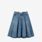 Blue denim skirt on a beige background