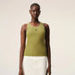 Green tank top with a small black logo on a beige background