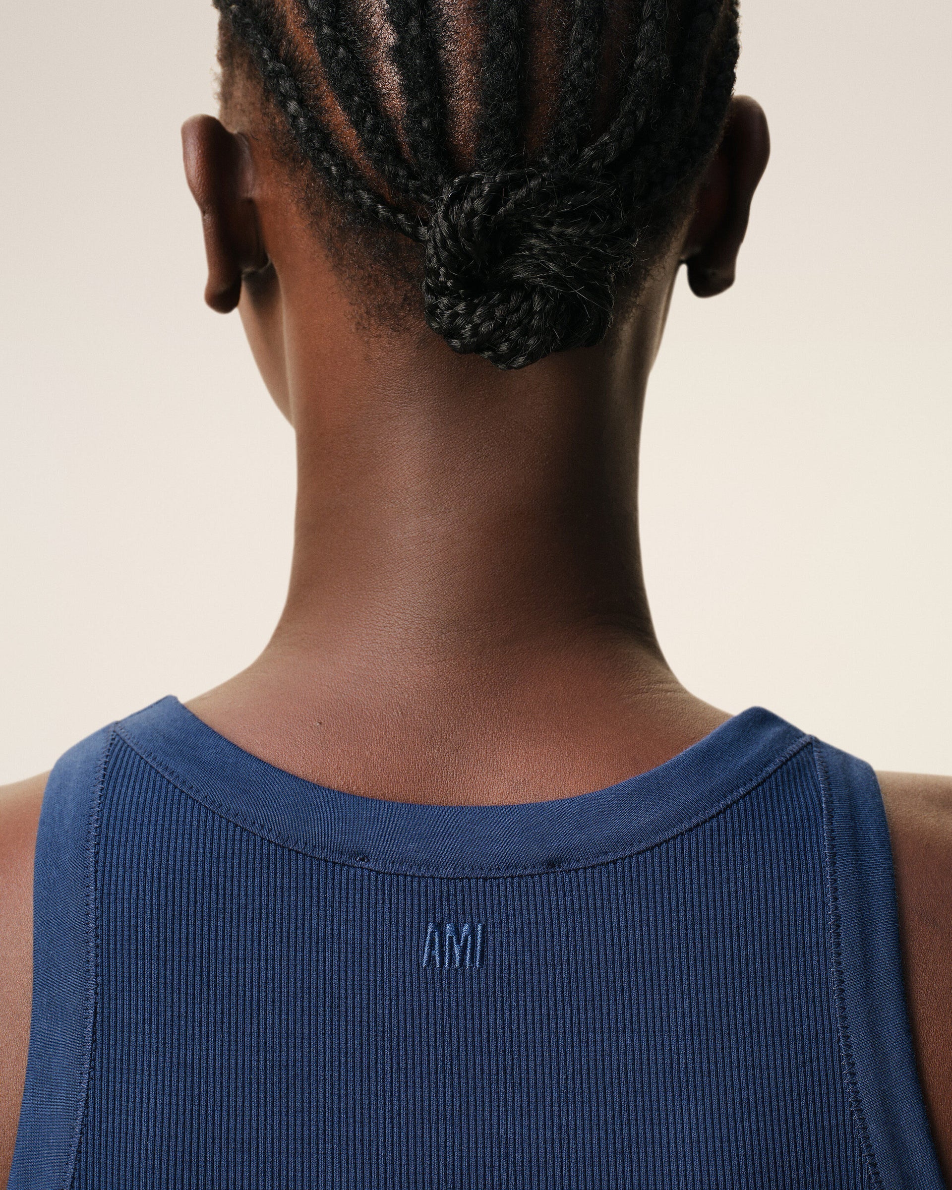 Blue tank top on a beige background