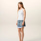 White tank top with a small black design on a beige background