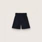 Women's shorts in black wool gabardine with waist belt