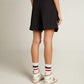 Women's shorts in black wool gabardine with waist belt