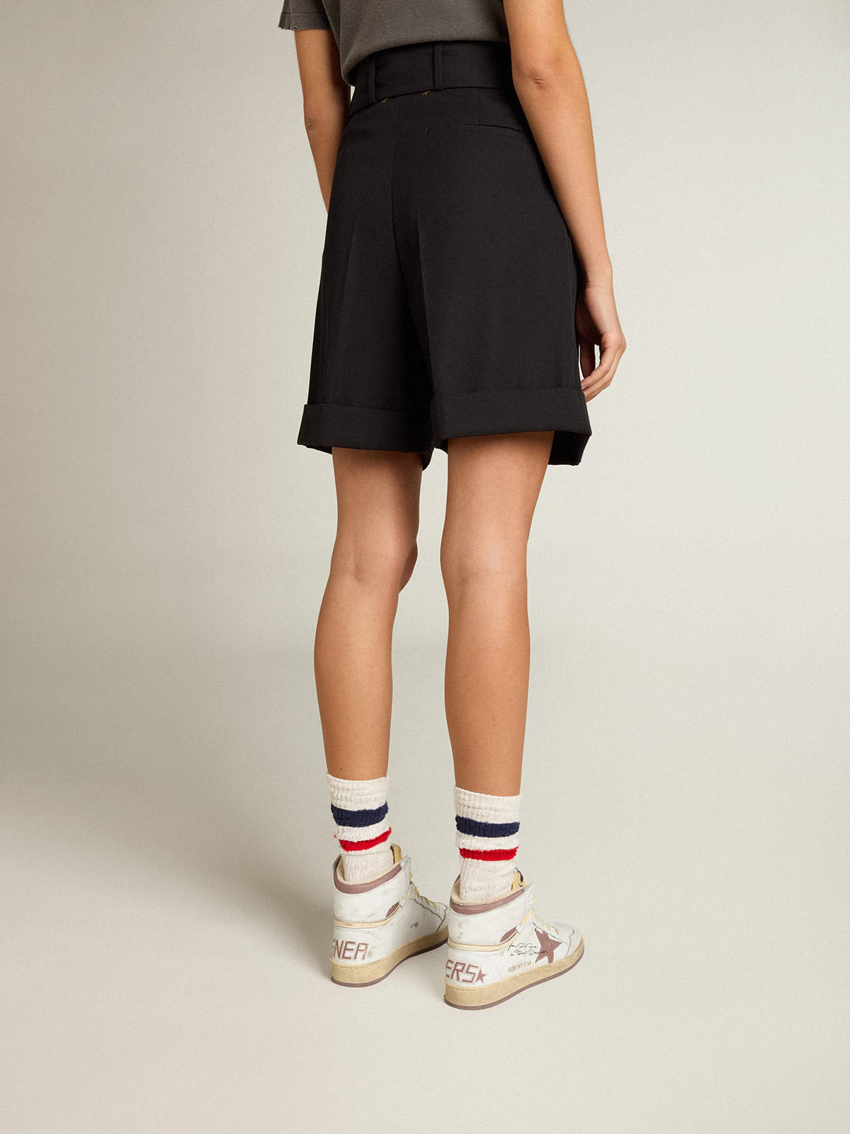 Women's shorts in black wool gabardine with waist belt