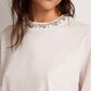 Women's white T-shirt with cabochon crystals
