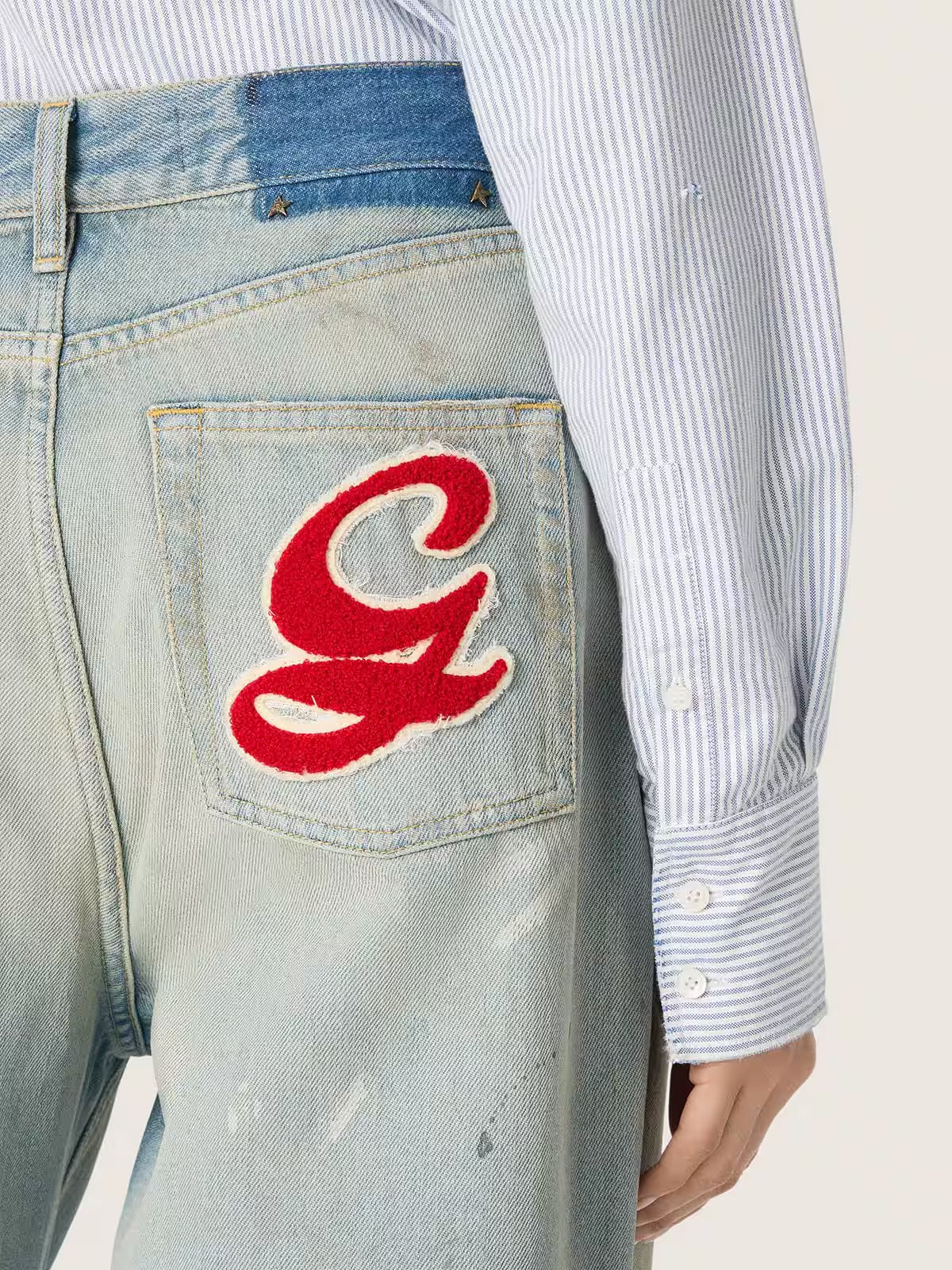 Women's jeans in light blue denim with Golden embroidered logo