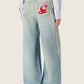 Women's jeans in light blue denim with Golden embroidered logo