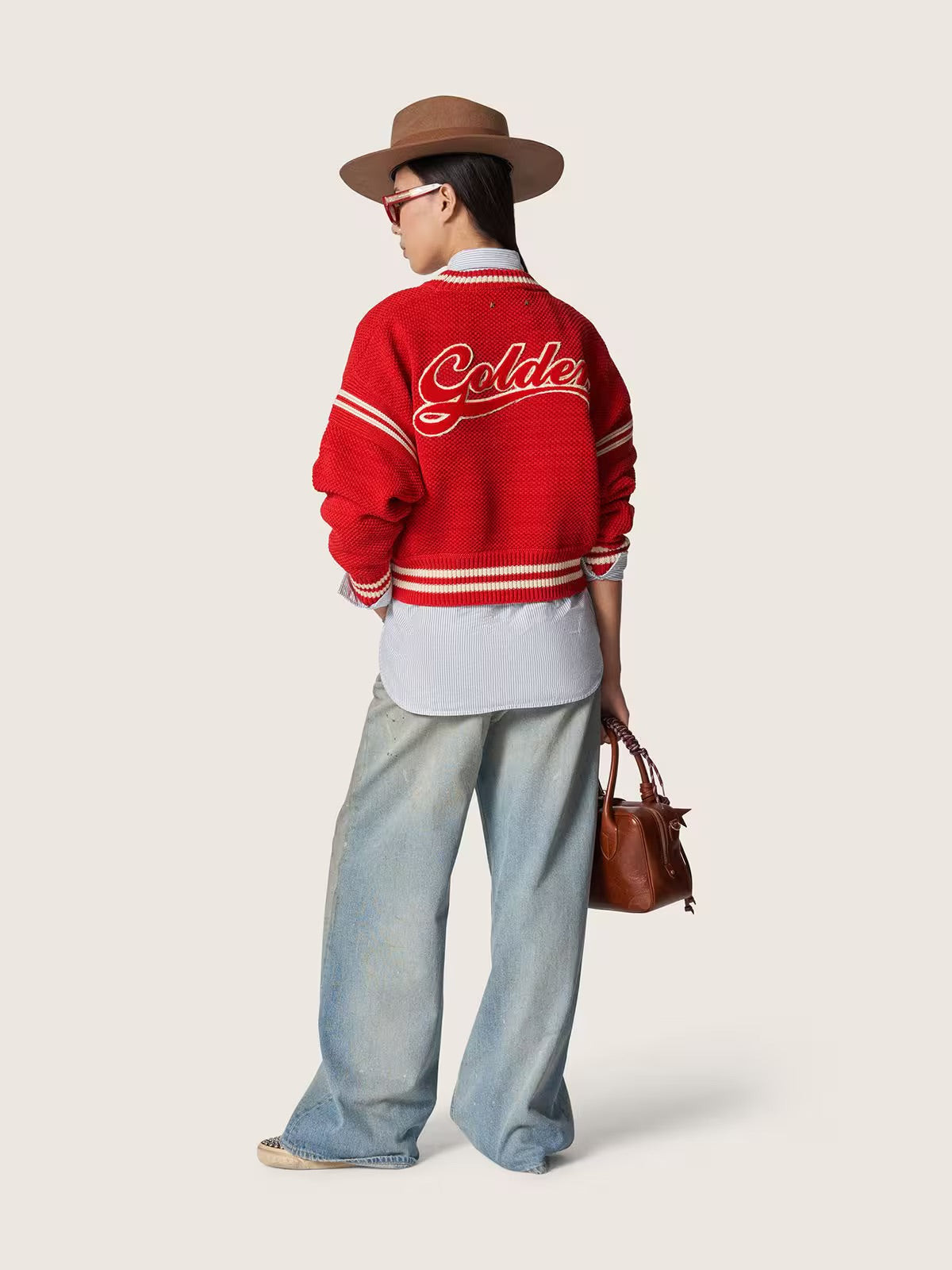 Women's jeans in light blue denim with Golden embroidered logo