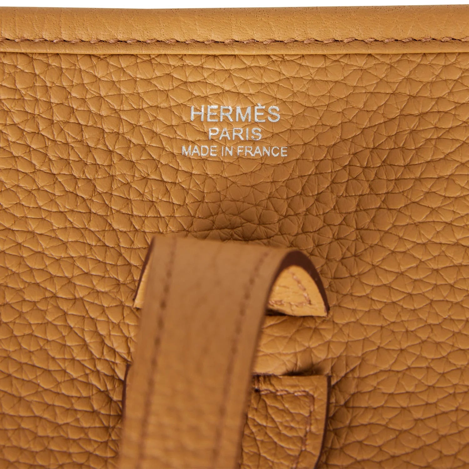 Brown leather handbag with brand logo on a white background hermes 