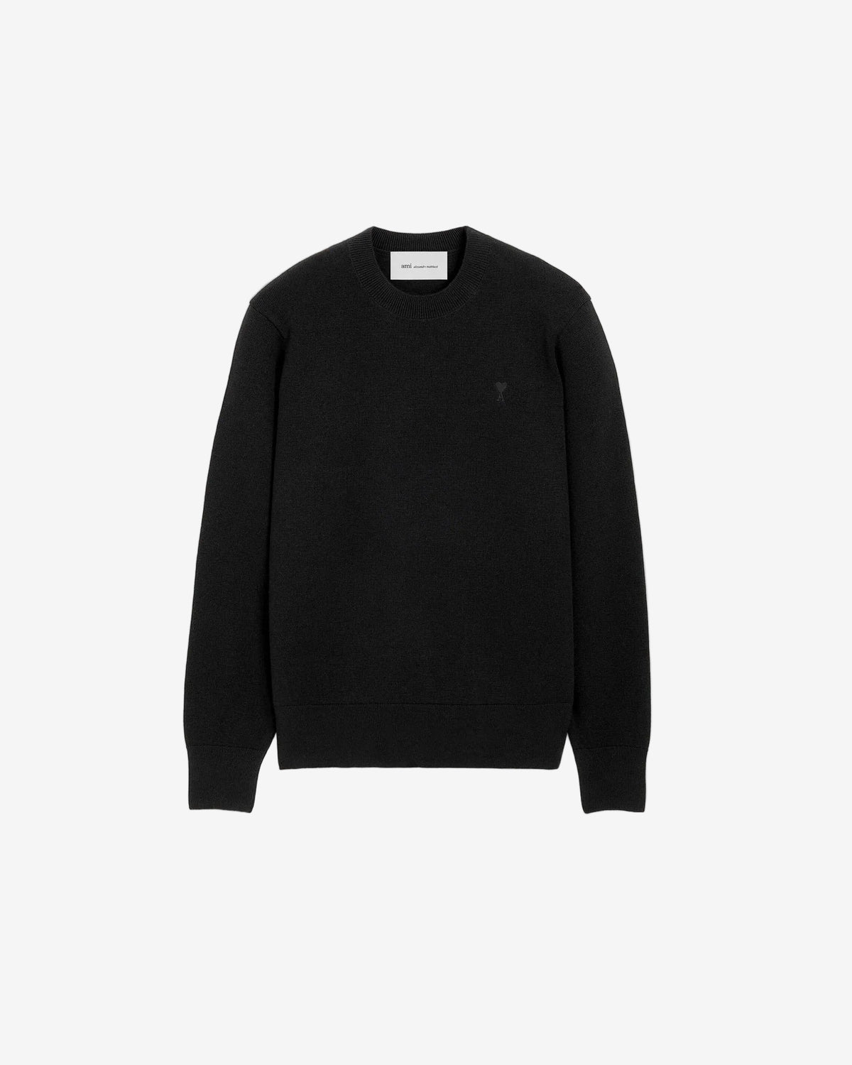 Black sweater on a beige background