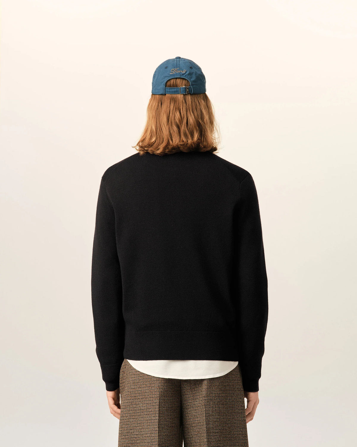 Black sweater on a beige background