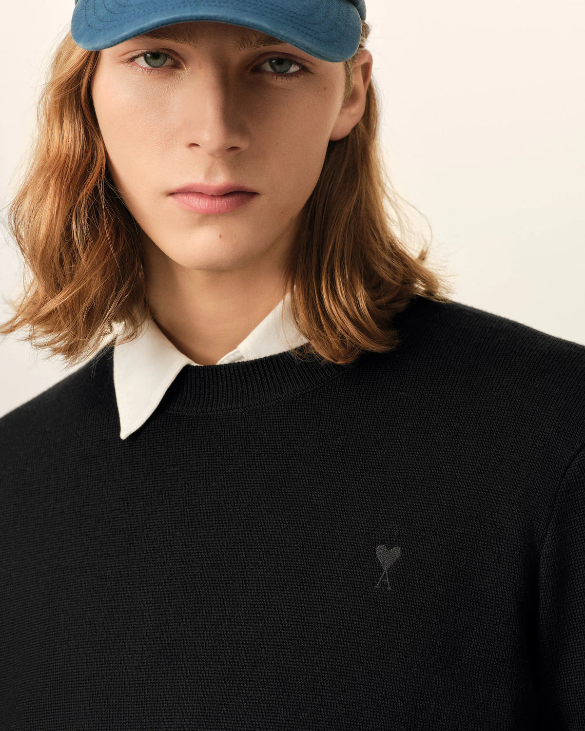Black sweater on a beige background