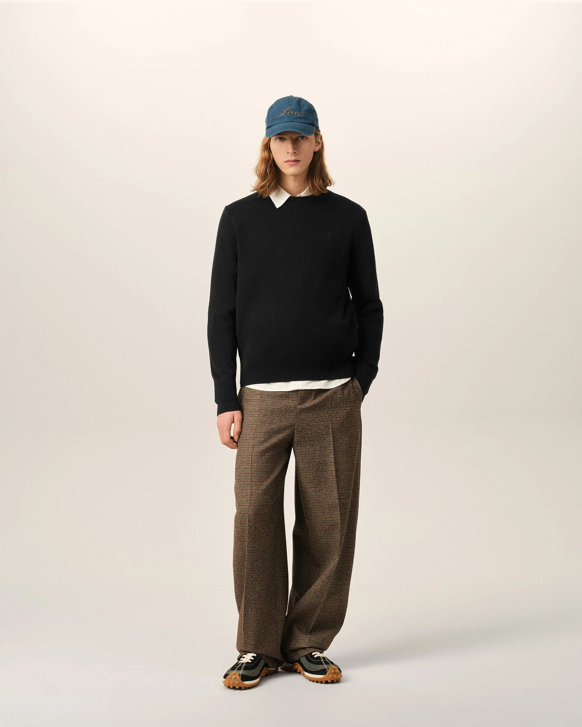 Black sweater on a beige background