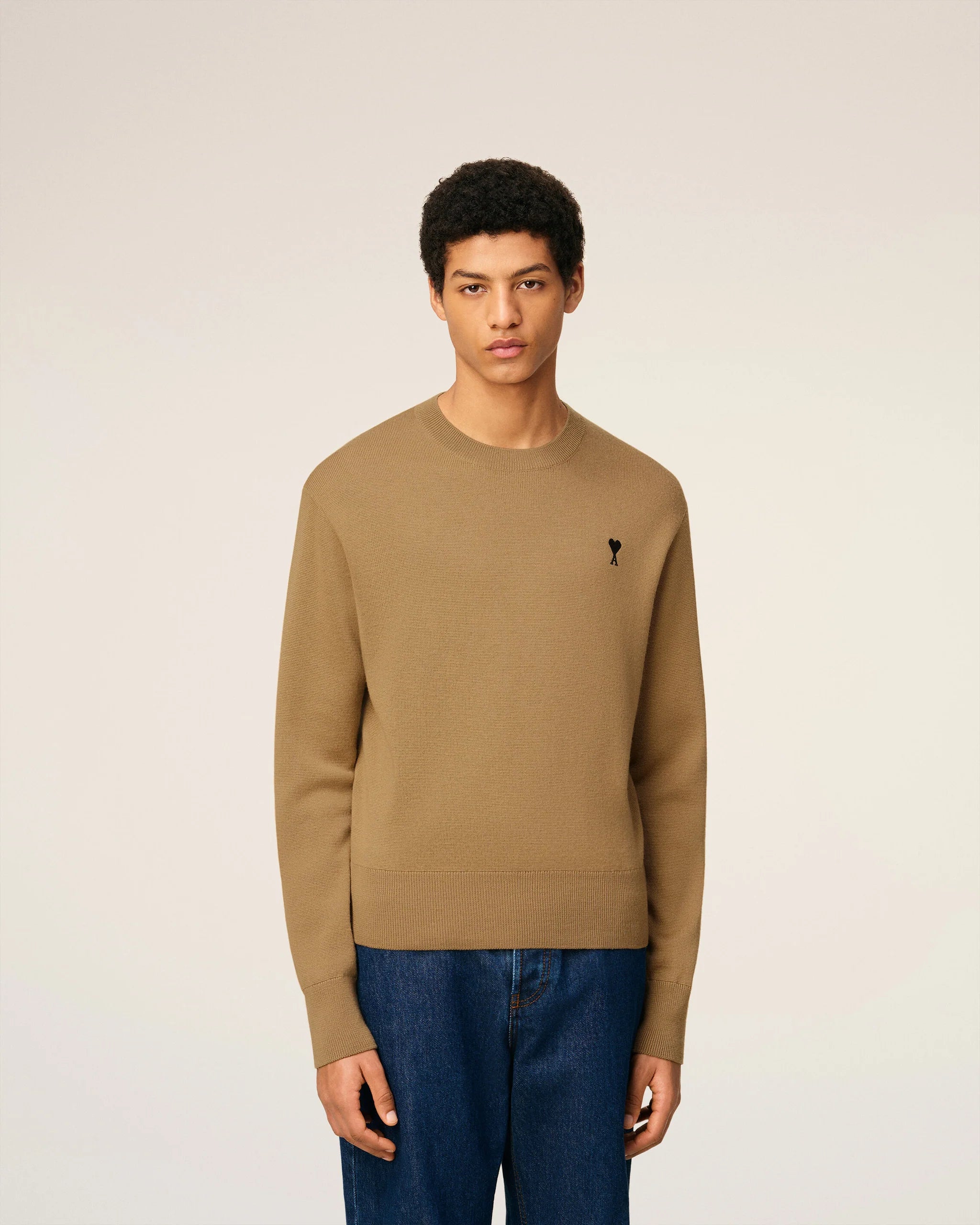 Beige sweater with a small black logo on a beige background ami paris SKU: FKS826.001