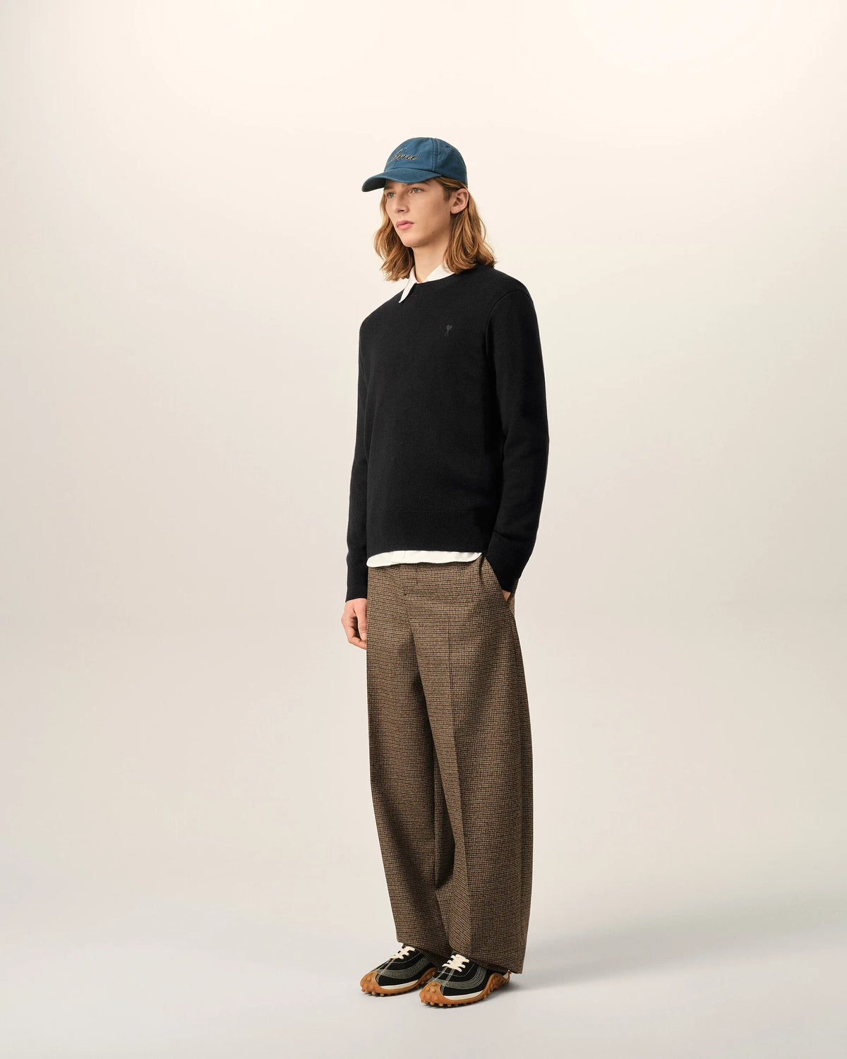 Black sweater on a beige background