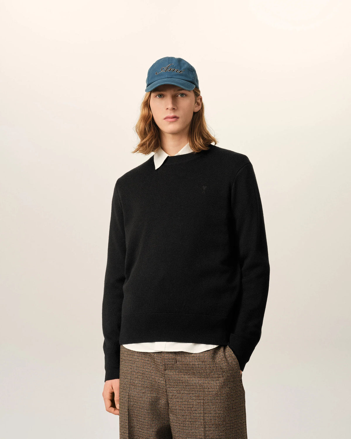 Black sweater on a beige background