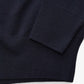 Navy blue sweater on a white background