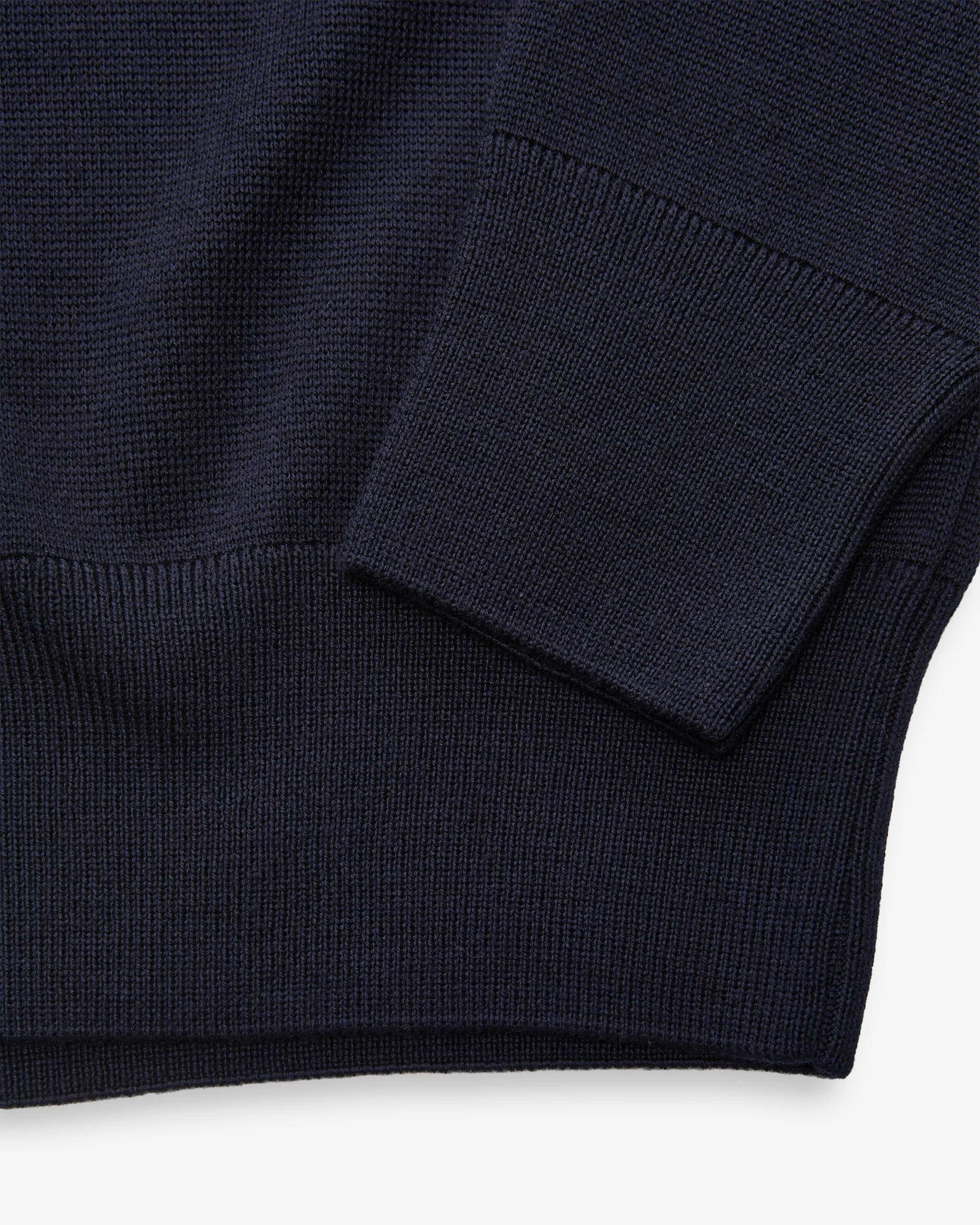Navy blue sweater on a white background