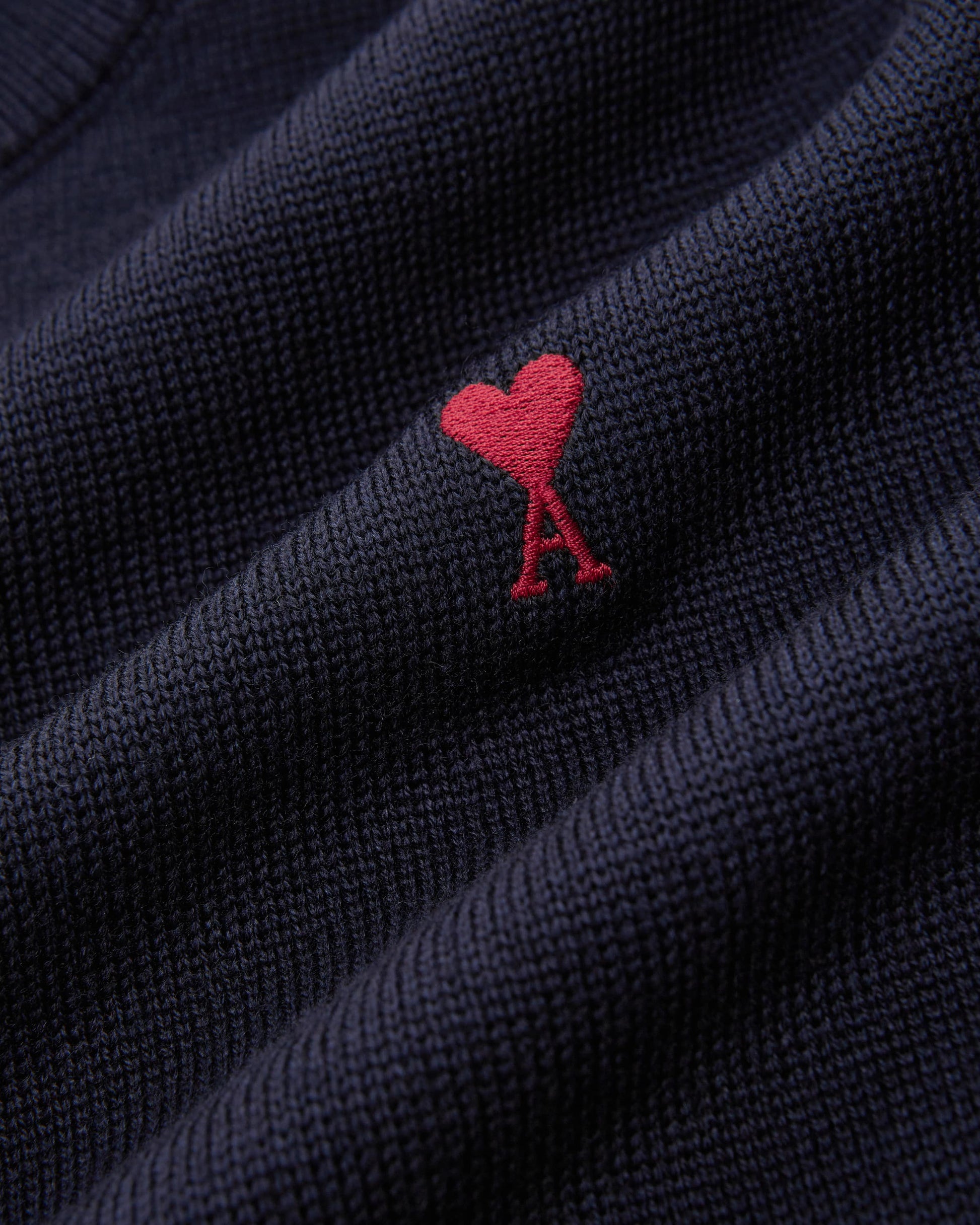 Navy blue sweater on a white background