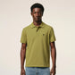 Green polo shirt on a light beige background ami paris