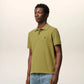 Green polo shirt on a light beige background ami paris
