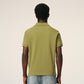 Green polo shirt on a light beige background ami paris