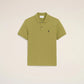 Green polo shirt on a light beige background ami paris