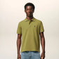 Green polo shirt on a light beige background ami paris