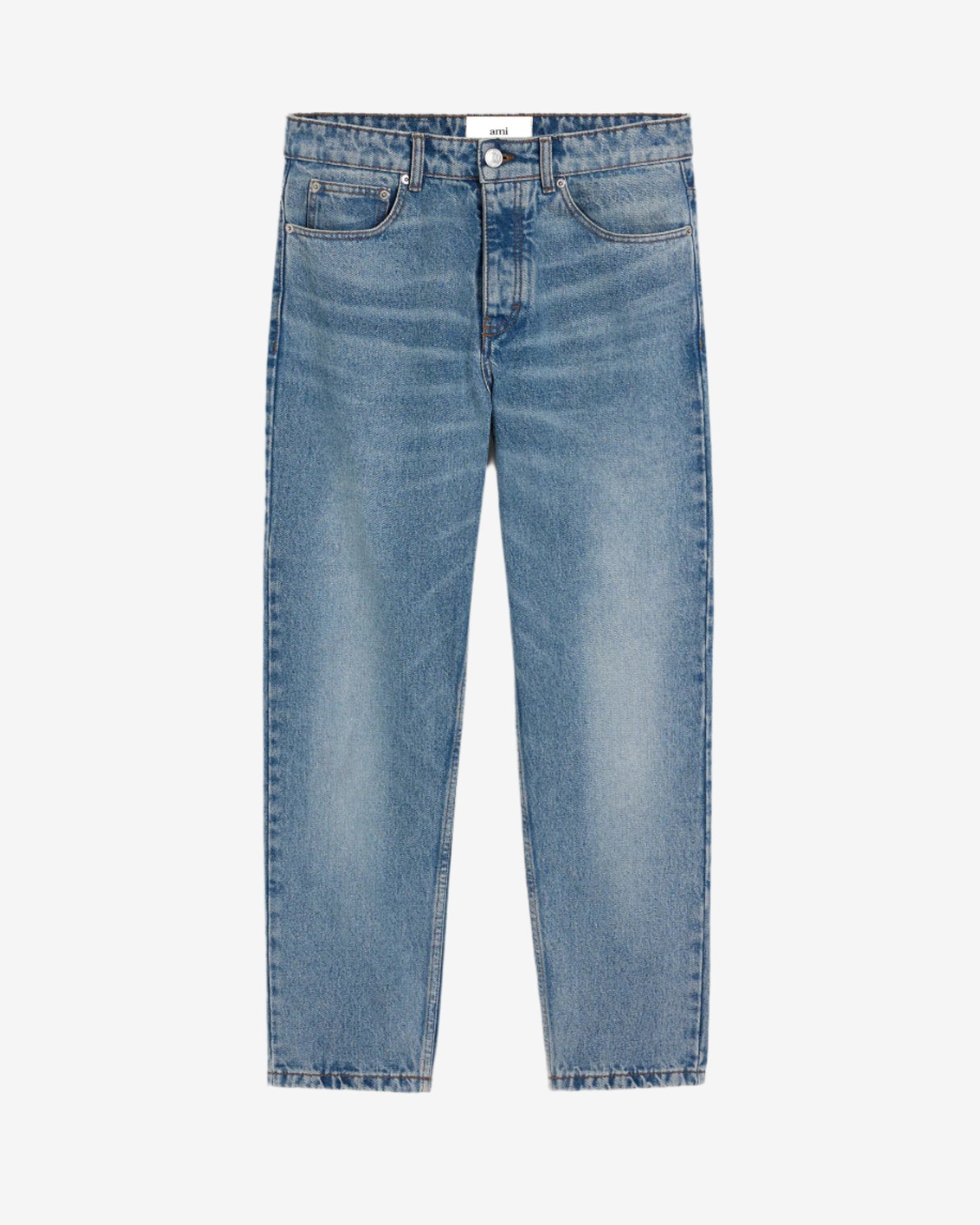 Blue jeans on a light beige background
